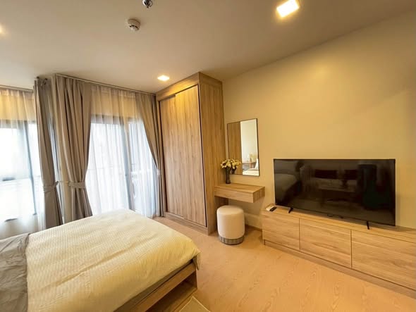 living room and bedroom of The Base Urban Rama9