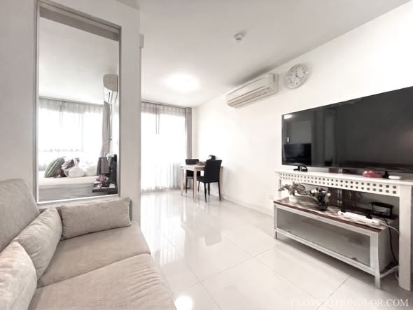 bedroom and living room of The Clover