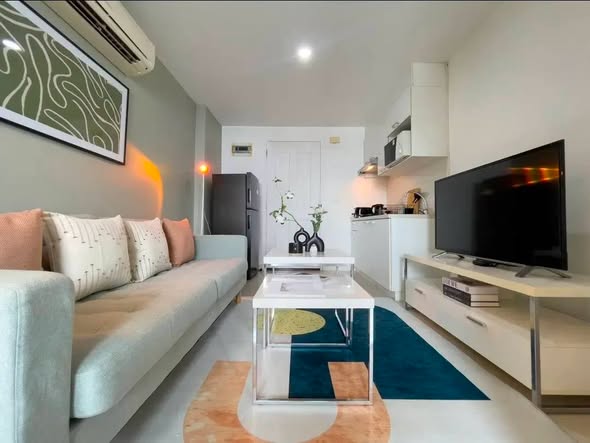 bedroom and living room of The Clover