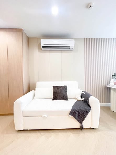 bedroom and living room of The Clover