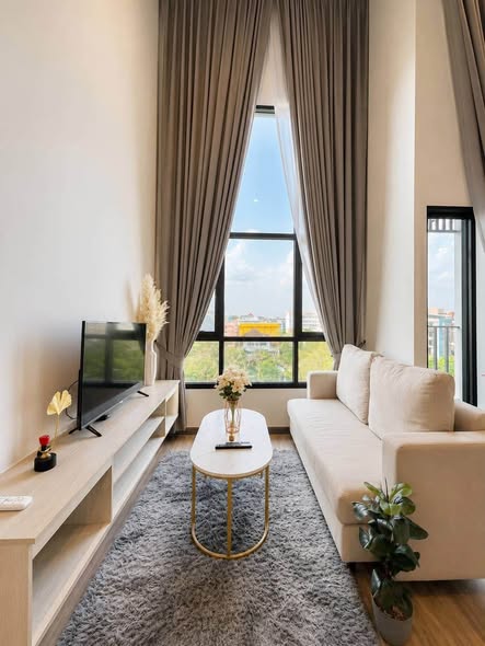 living room and bedroom of The Collect Ratchada 32