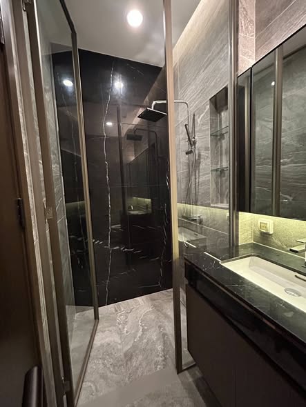 room interior and bathroom of THE ESSE Sukhumvit 36