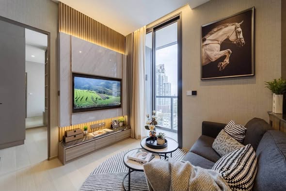 living room and bedroom of THE EXTRO Phayathai-Rangnam