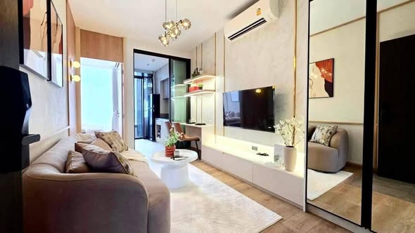 living room and bedroom of The Fine Bangkok