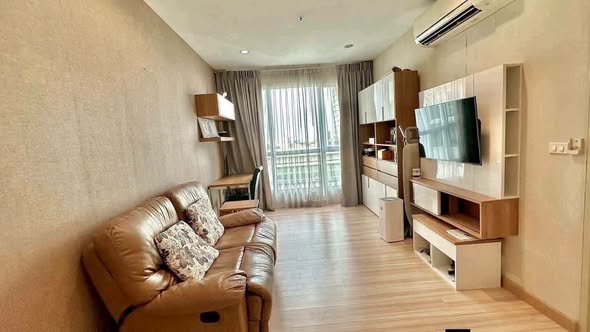 bedroom and living room of The Hotel Serviced Condo เดอะโฮเทล คอนโด