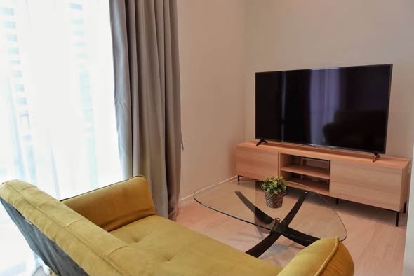 living room and bedroom of The Lofts Silom by Raimon Land
