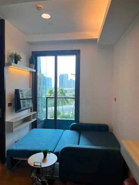 living room and bedroom of The Lumpini 24