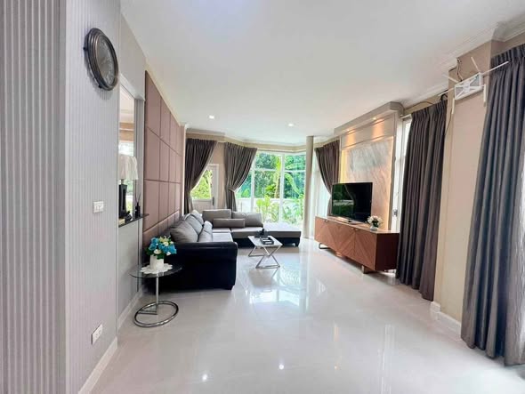 bedroom and living room of The Metro Rama 9