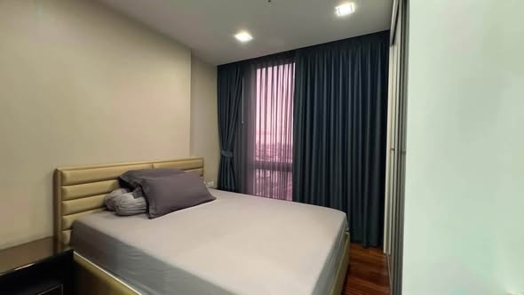 bedroom of The Metropolis Samrong