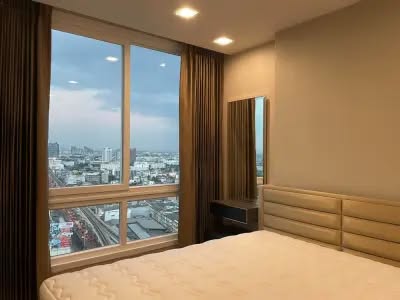 bedroom of The Metropolis Samrong