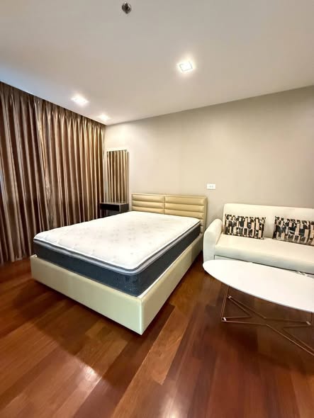 bedroom of The Metropolis Samrong