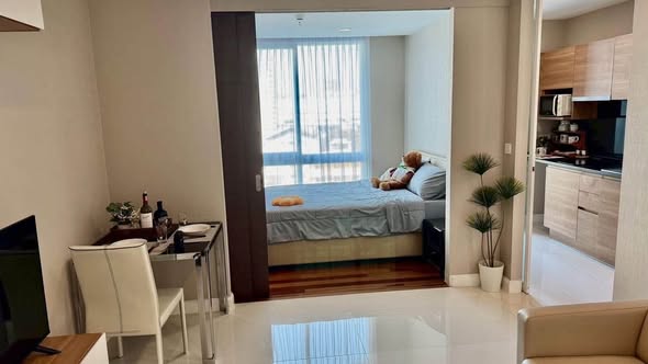 bedroom and living room of The Metropolis Samrong