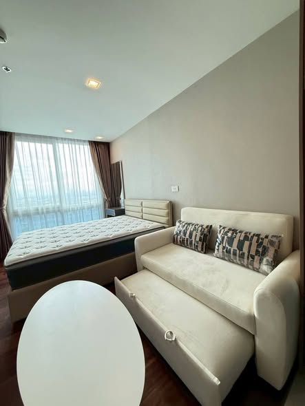 bedroom and living room of The Metropolis Samrong