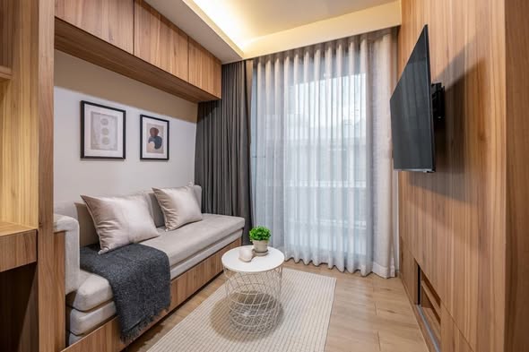 living room and bedroom of The Nest Ploenchit