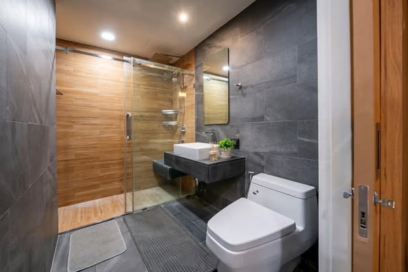room interior and bathroom of The Nest Ploenchit