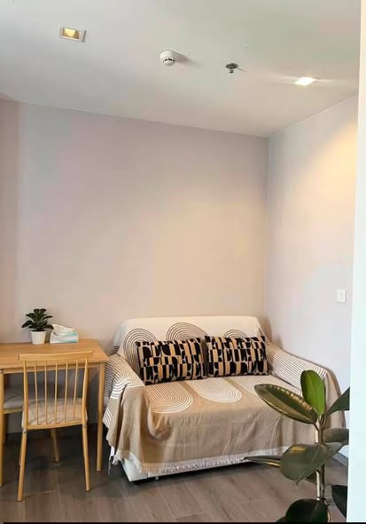bedroom and living room of The Politan Rive