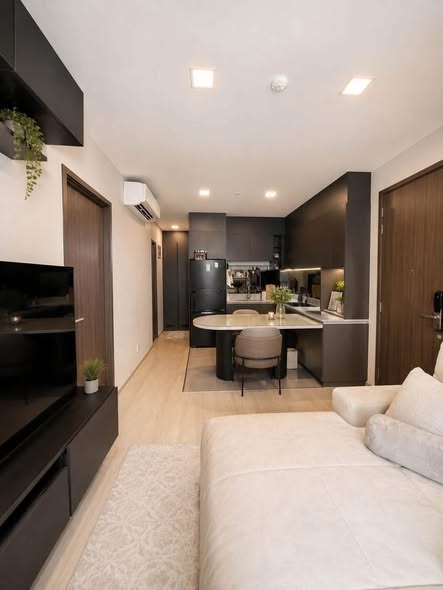 bedroom and living room of The Privacy Jatujak