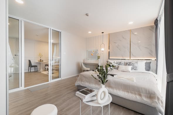 bedroom and room interior of The Raffles Condominium