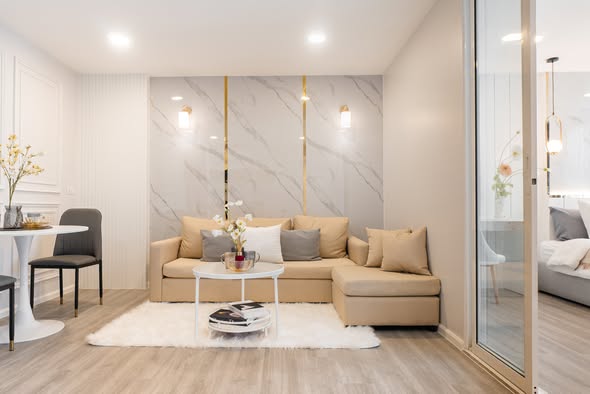 living room and bedroom of The Raffles Condominium
