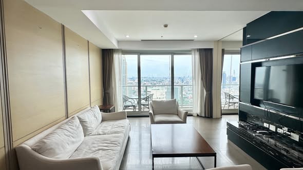bedroom and living room of The River Condominium
