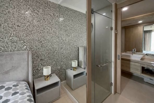 bedroom and bathroom of The Riviera Jomtien