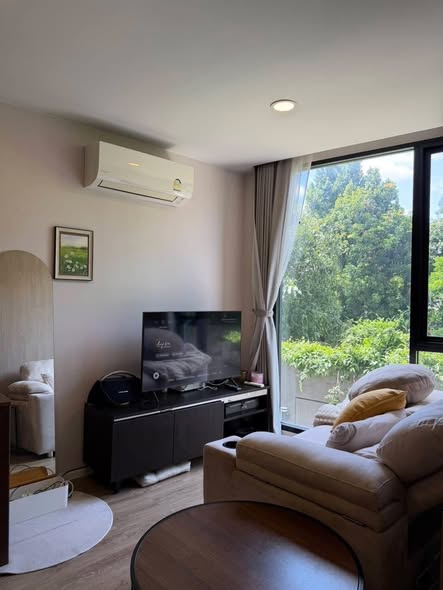 bedroom and living room of The TEAK Sathon-Lumphini
