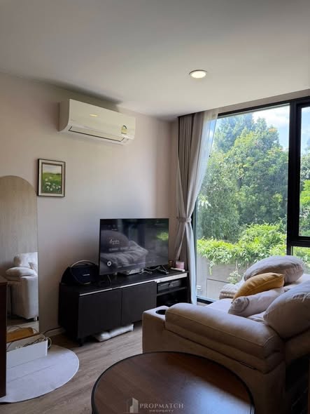 bedroom and living room of The TEAK Sathon-Lumphini