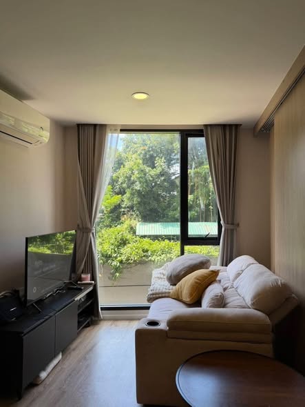 living room and bedroom of The TEAK Sathon-Lumphini