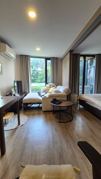 living room and bedroom of The TEAK Sathon-Lumphini