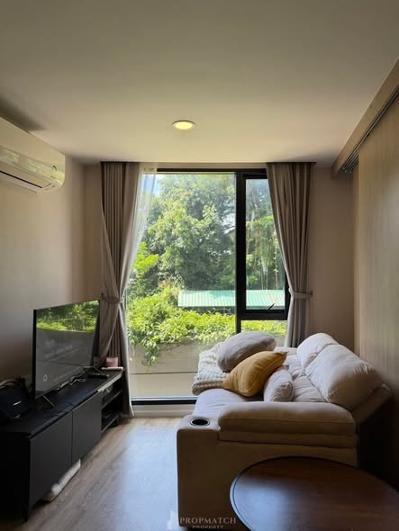 living room and bedroom of The TEAK Sathon-Lumphini