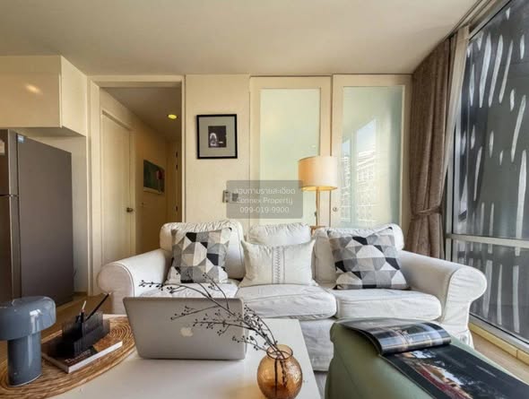 bedroom and living room of The Tempo Ruamrudee