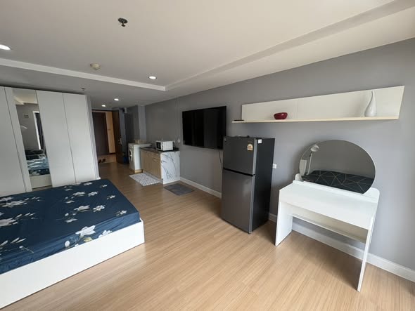 bedroom of The Trendy Condominium