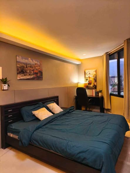 bedroom of The Trio Condo