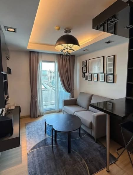 bedroom and living room of Thru Thong Lor