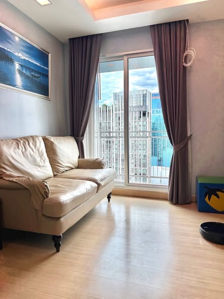 living room and bedroom of Thru Thong Lor