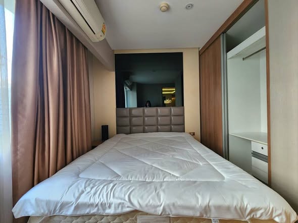 bedroom of Tidy Deluxe Condominium