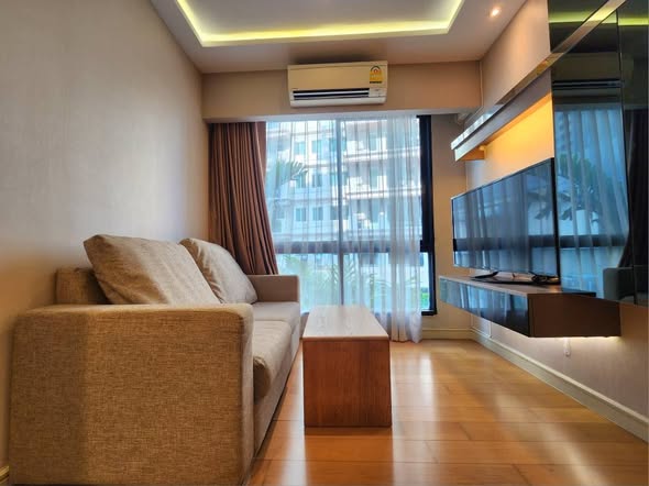 living room and bedroom of Tidy Deluxe Condominium