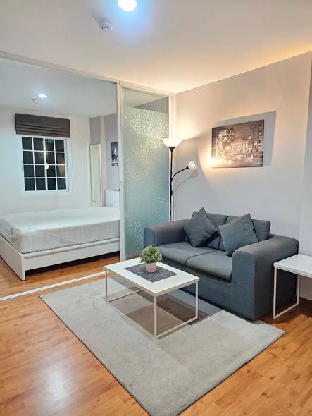 bedroom and living room of Tulip Square Condo