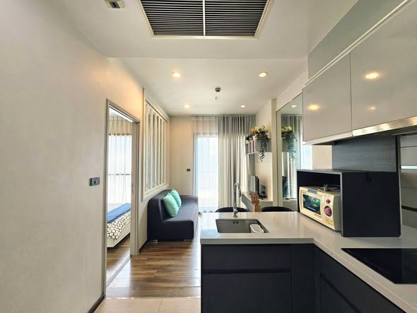 living room and kitchen of WYNE by Sansiri