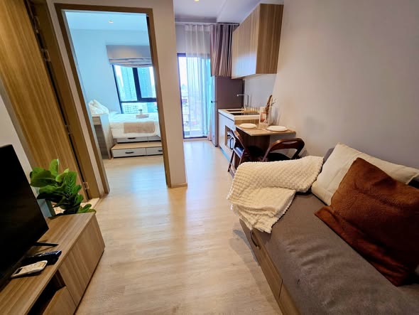 living room and bedroom of Altitude Unicorn Sathorn