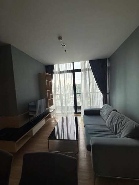 bedroom and living room of อัพเอกมัยคอนโดมิเนียม