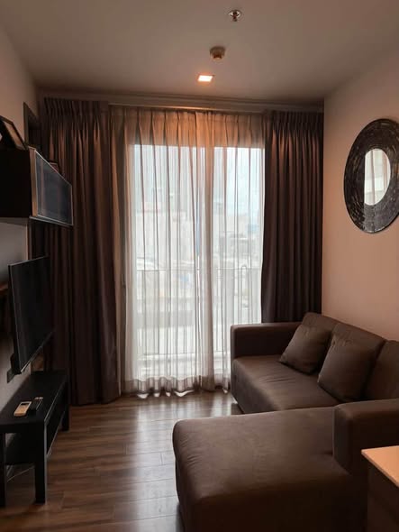 bedroom and living room of CEIL By Sansiri