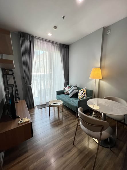 bedroom and living room of CEIL By Sansiri