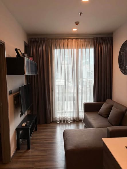 bedroom and living room of CEIL By Sansiri