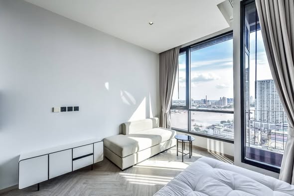 bedroom and living room of Chapter Charoennakhon–Riverside