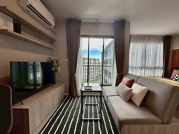 bedroom and living room of dcondo Campus Hideaway