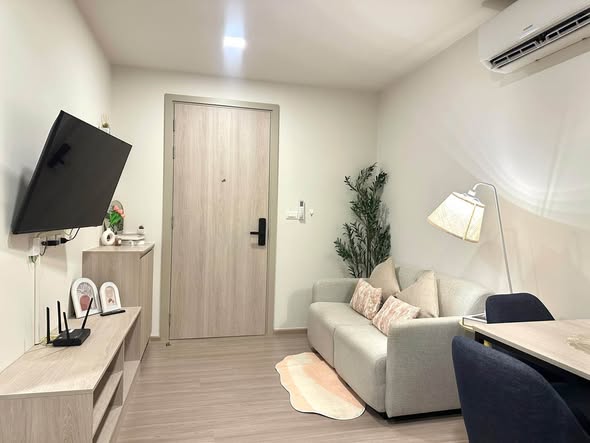 bedroom and living room of dcondo Reef Phuket
