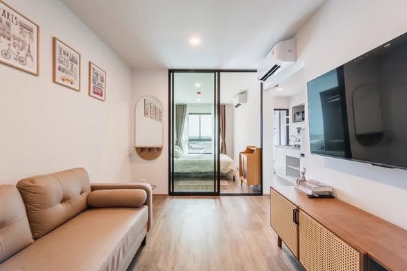 living room and room interior of HI Kaset-Sena Nikhom Station by AOS