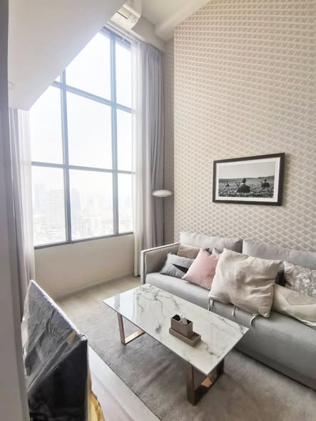 bedroom and living room of KnightsBridge Prime Sathon