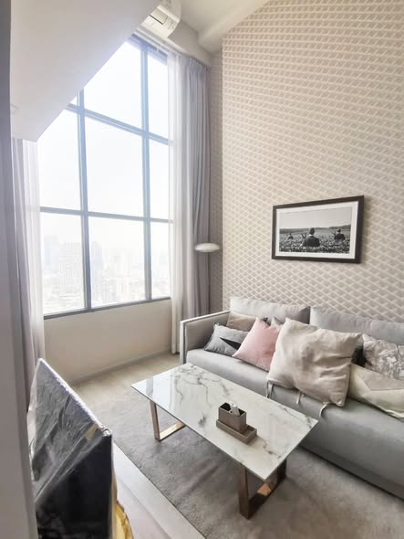 living room and bedroom of KnightsBridge Prime Sathon